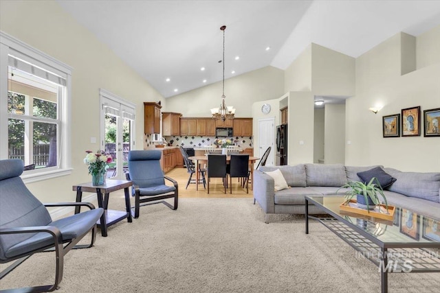 2627 E Moog St, Meridian, ID 83646 - living area featuring a chandelier, high vaulted ceiling, and recessed lighting