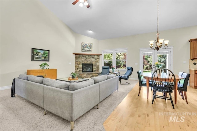2627 E Moog St, Meridian, ID 83646 - living area featuring a chandelier, baseboards, a fireplace, lofted ceiling, and a ceiling fan
