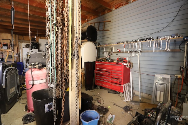 interior space featuring water heater and a workshop area