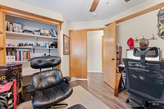 office space with wood finished floors and a ceiling fan