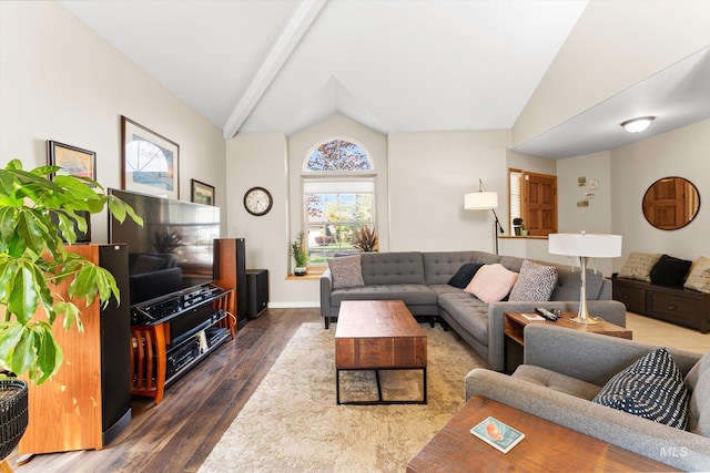 living area with wood finished floors, vaulted ceiling with beams, and baseboards