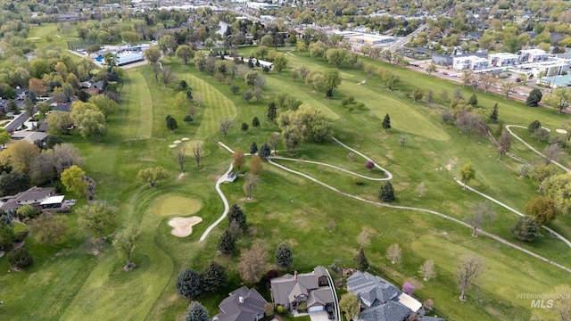 birds eye view of property with view of golf course and a residential view