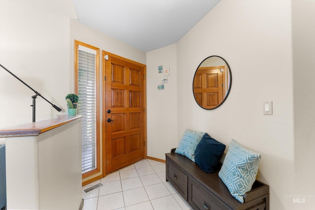 foyer entrance featuring visible vents and light tile patterned floors