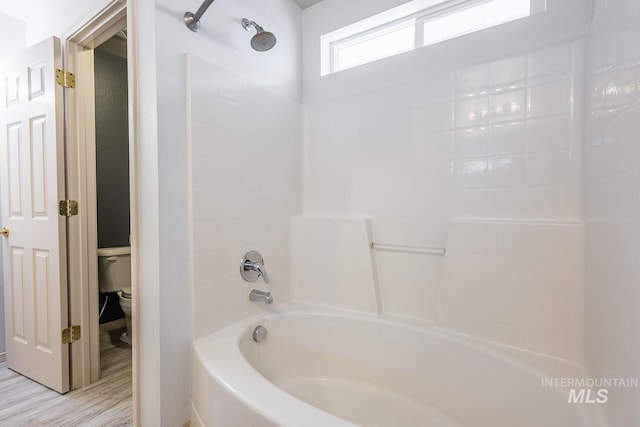 9885 W Tilmont St, Boise, ID 83709 - full bathroom featuring toilet, bathtub / shower combination, and wood finished floors
