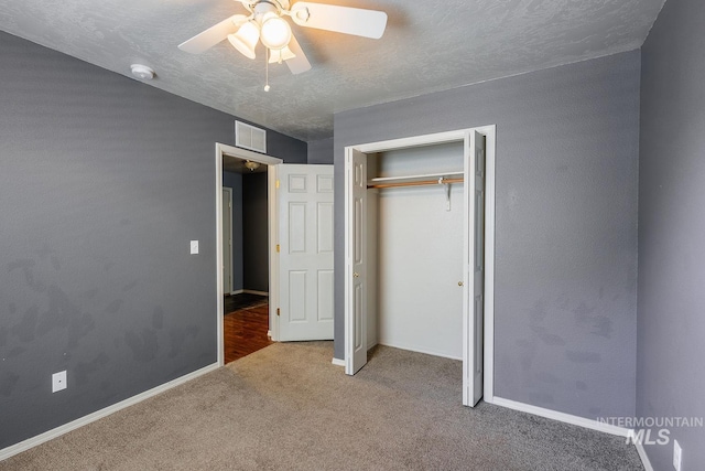 9885 W Tilmont St, Boise, ID 83709 - unfurnished bedroom with carpet, a closet, baseboards, a ceiling fan, and a textured ceiling