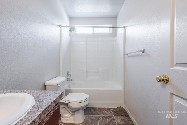 9885 W Tilmont St, Boise, ID 83709 - full bathroom featuring toilet, vanity, baseboards, shower / bath combination, and a textured wall