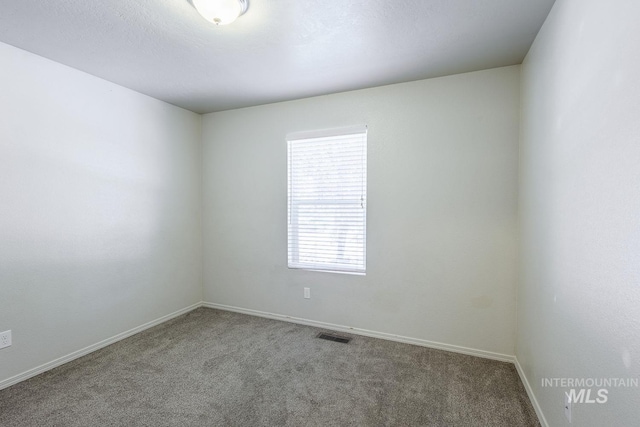 9885 W Tilmont St, Boise, ID 83709 - spare room with carpet flooring and baseboards