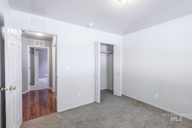 9885 W Tilmont St, Boise, ID 83709 - unfurnished bedroom featuring carpet flooring, baseboards, a closet, and a textured ceiling