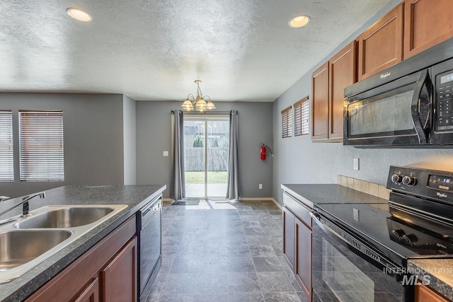 9885 W Tilmont St, Boise, ID 83709 - kitchen with black appliances, a sink, a chandelier, brown cabinets, and dark countertops
