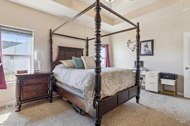 carpeted bedroom with visible vents and baseboards