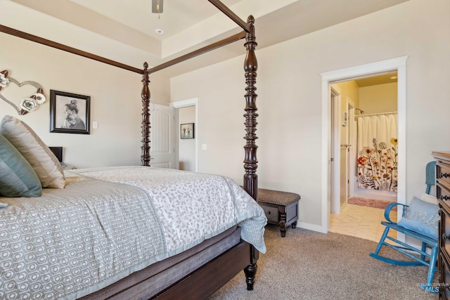 carpeted bedroom featuring baseboards