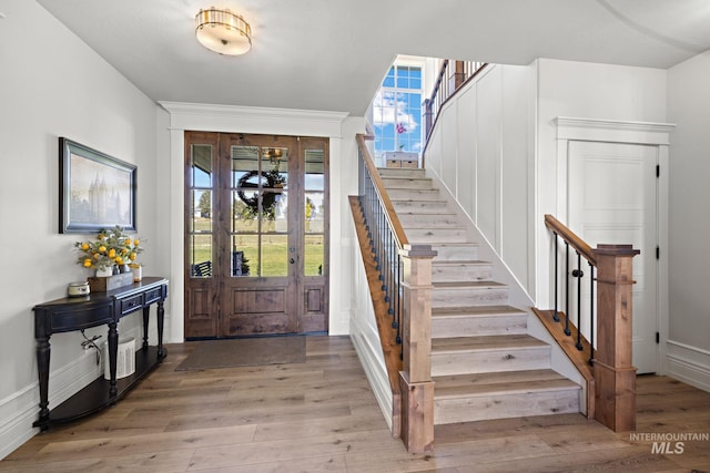 17293 Goodson Rd, Caldwell, ID 83607 - entryway featuring stairs, light wood-style flooring, and a healthy amount of sunlight