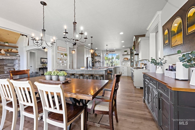 17293 Goodson Rd, Caldwell, ID 83607 - dining room with arched walkways, recessed lighting, and light wood-style floors