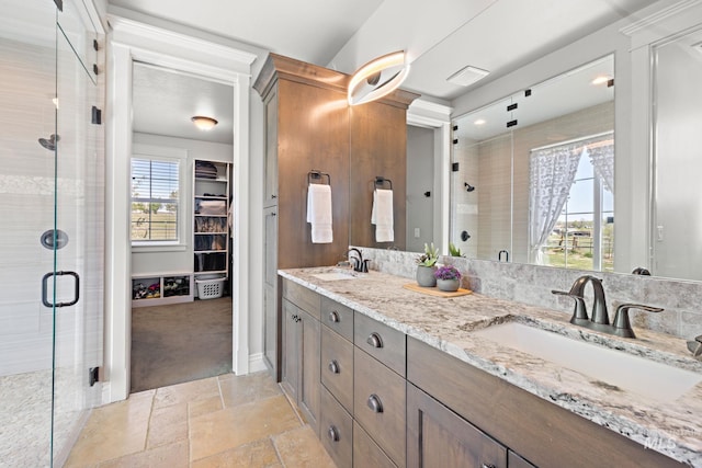17293 Goodson Rd, Caldwell, ID 83607 - full bath with a shower stall, a spacious closet, stone tile floors, and a sink