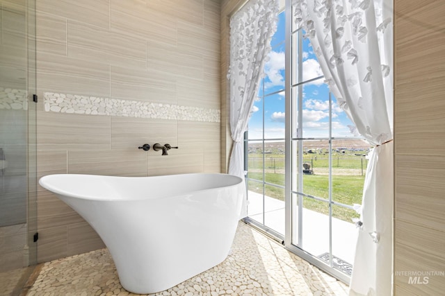 17293 Goodson Rd, Caldwell, ID 83607 - full bath featuring a soaking tub and tile walls
