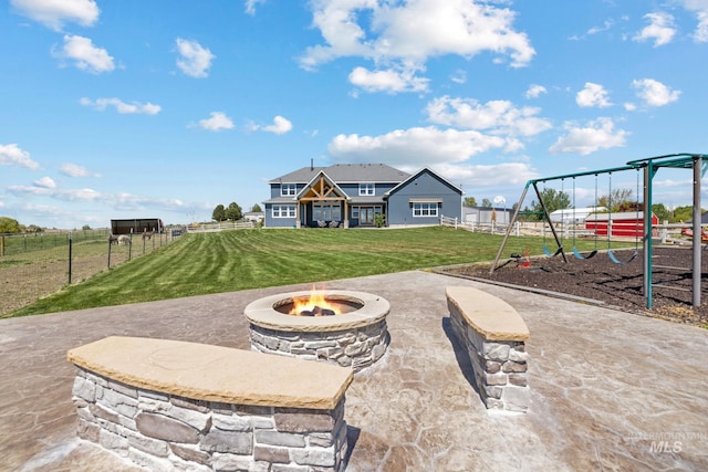 17293 Goodson Rd, Caldwell, ID 83607 - exterior space featuring an outdoor fire pit, a playground, and fence