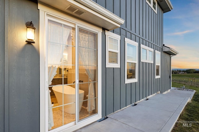 17293 Goodson Rd, Caldwell, ID 83607 - view of exterior entry featuring board and batten siding and visible vents