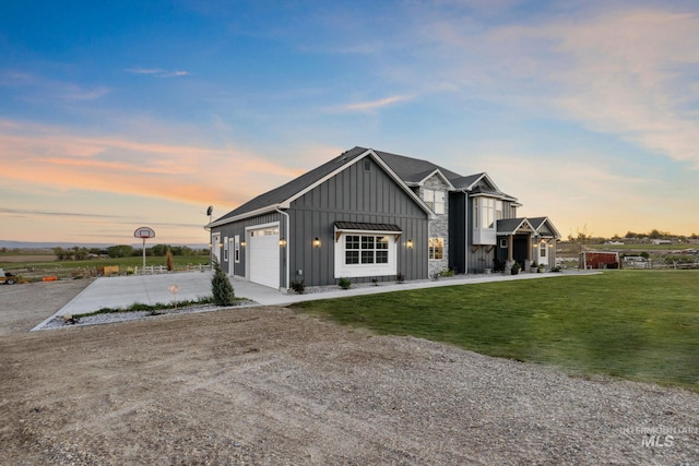 17293 Goodson Rd, Caldwell, ID 83607 - modern farmhouse style home with a garage, a lawn, board and batten siding, and concrete driveway