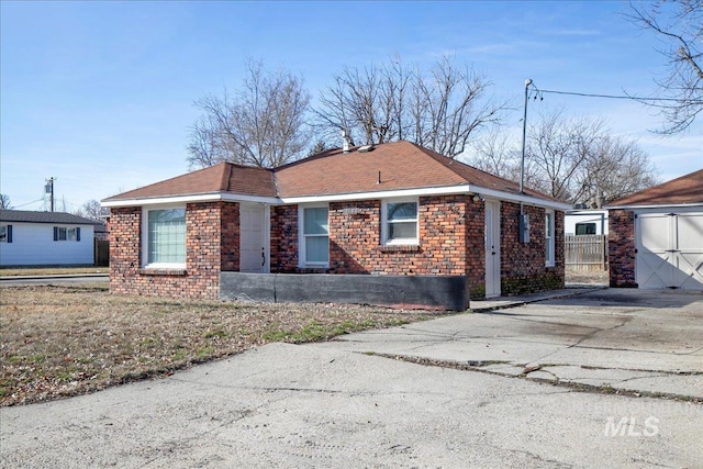 view of front of house featuring brick siding