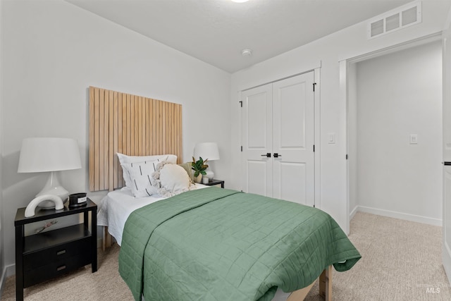 carpeted bedroom with a closet