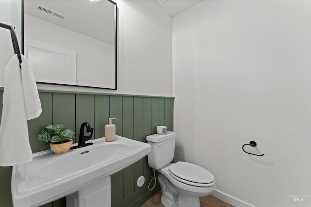 bathroom with toilet and sink