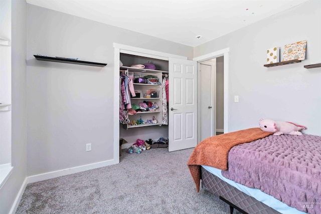 bedroom featuring carpet flooring, a closet, and baseboards