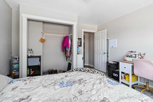 bedroom featuring a closet and baseboards