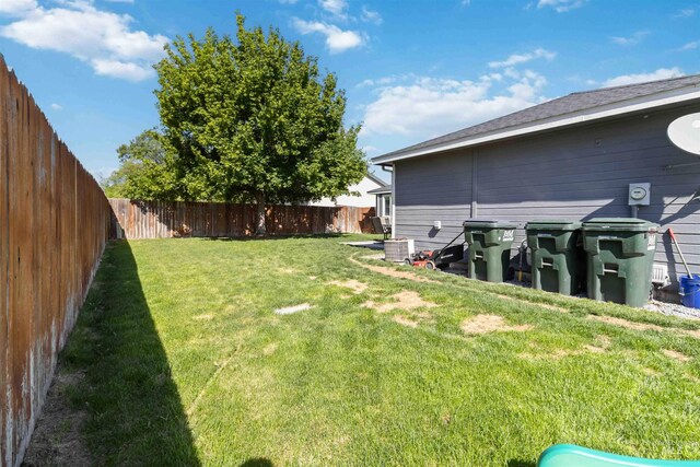 view of yard with central AC