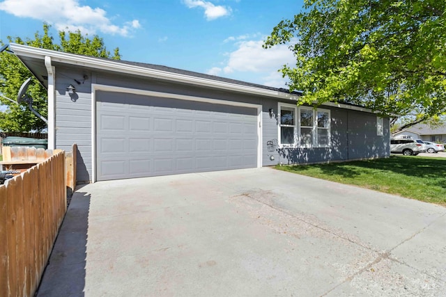 garage featuring driveway