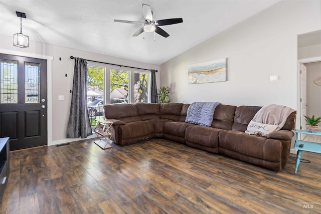 living area featuring lofted ceiling, wood finished floors, and a ceiling fan