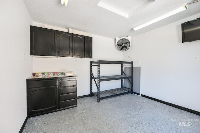 interior space featuring a textured ceiling