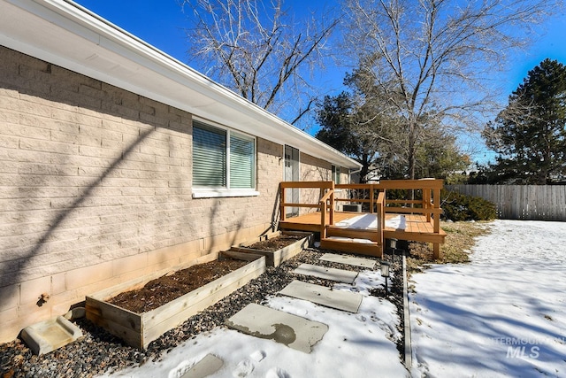 view of snow covered deck