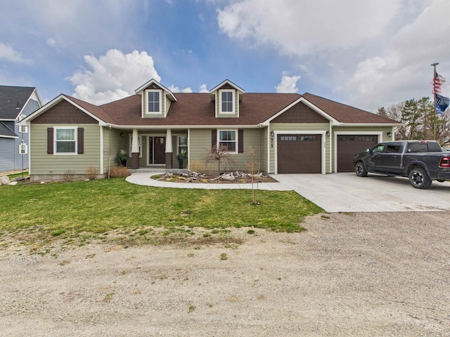 515 School St, Albion, ID 83311 - view of front of house featuring a garage, a front lawn, covered porch, and driveway