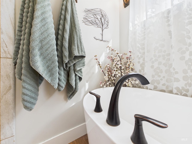 515 School St, Albion, ID 83311 - full bath featuring a bathtub and wood finished floors