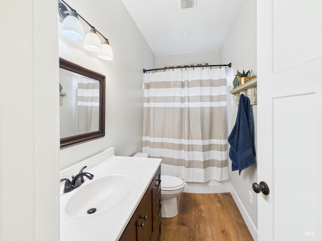 515 School St, Albion, ID 83311 - bathroom with vanity, wood finished floors, and a shower with curtain