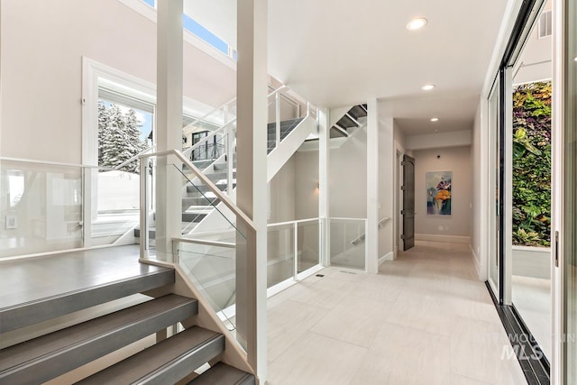 stairway with light tile floors