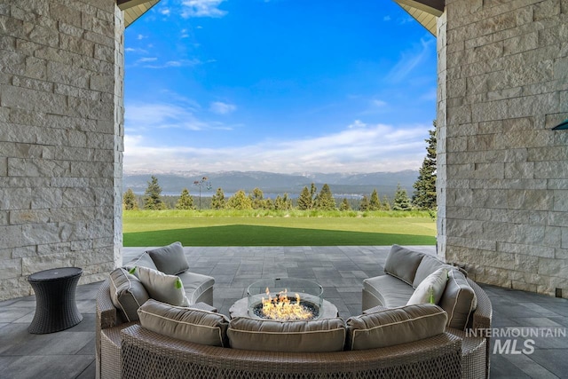 view of patio / terrace featuring a mountain view and an outdoor living space