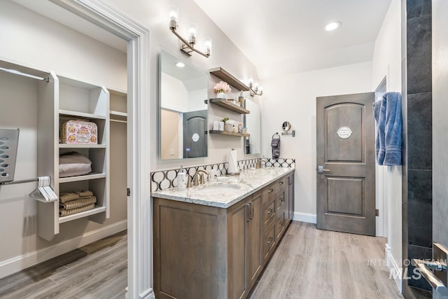 bathroom featuring oversized vanity and hardwood / wood-style floors