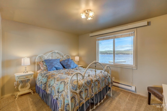 carpeted bedroom with a water view and a baseboard radiator