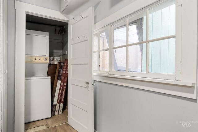 710 N 15th St, Boise, ID 83702 - washroom with stacked washer / dryer and light wood-type flooring