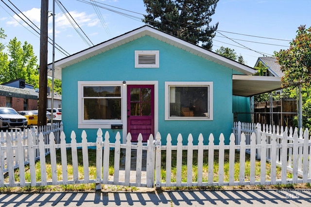 710 N 15th St, Boise, ID 83702 - view of front of house featuring a fenced front yard and stucco siding