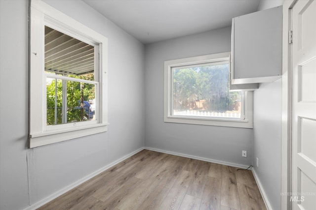 710 N 15th St, Boise, ID 83702 - spare room with wood finished floors and baseboards
