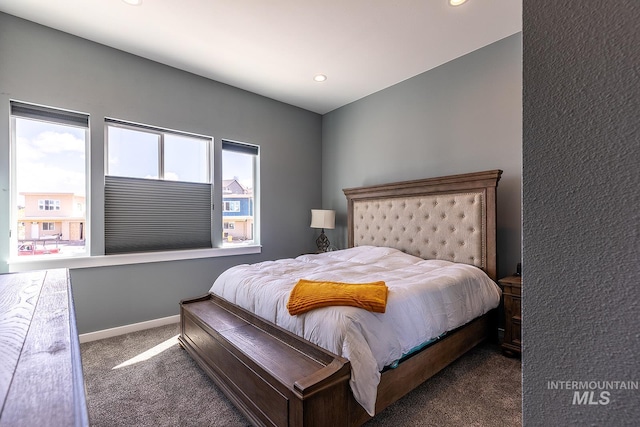 bedroom with baseboards, dark colored carpet, and recessed lighting