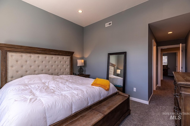 bedroom featuring dark colored carpet, recessed lighting, visible vents, and baseboards