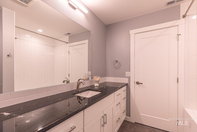 bathroom featuring recessed lighting, visible vents, and vanity