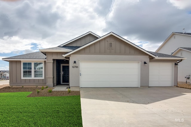 view of front of home with a garage and a front yard