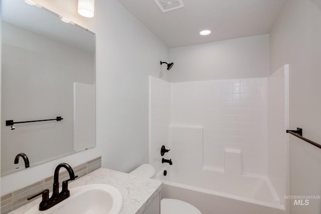 full bathroom with shower / bathtub combination, vanity, and toilet