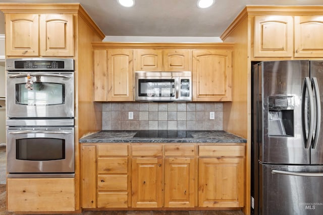 kitchen with dark countertops, tasteful backsplash, stainless steel appliances, and recessed lighting