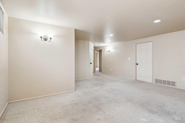 spare room featuring recessed lighting, visible vents, baseboards, and light colored carpet