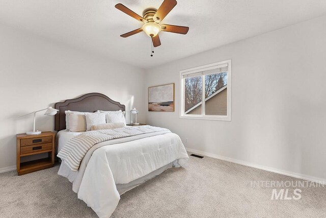 1472 N Watson Ave, Eagle, ID 83616 - carpeted bedroom featuring baseboards and a ceiling fan